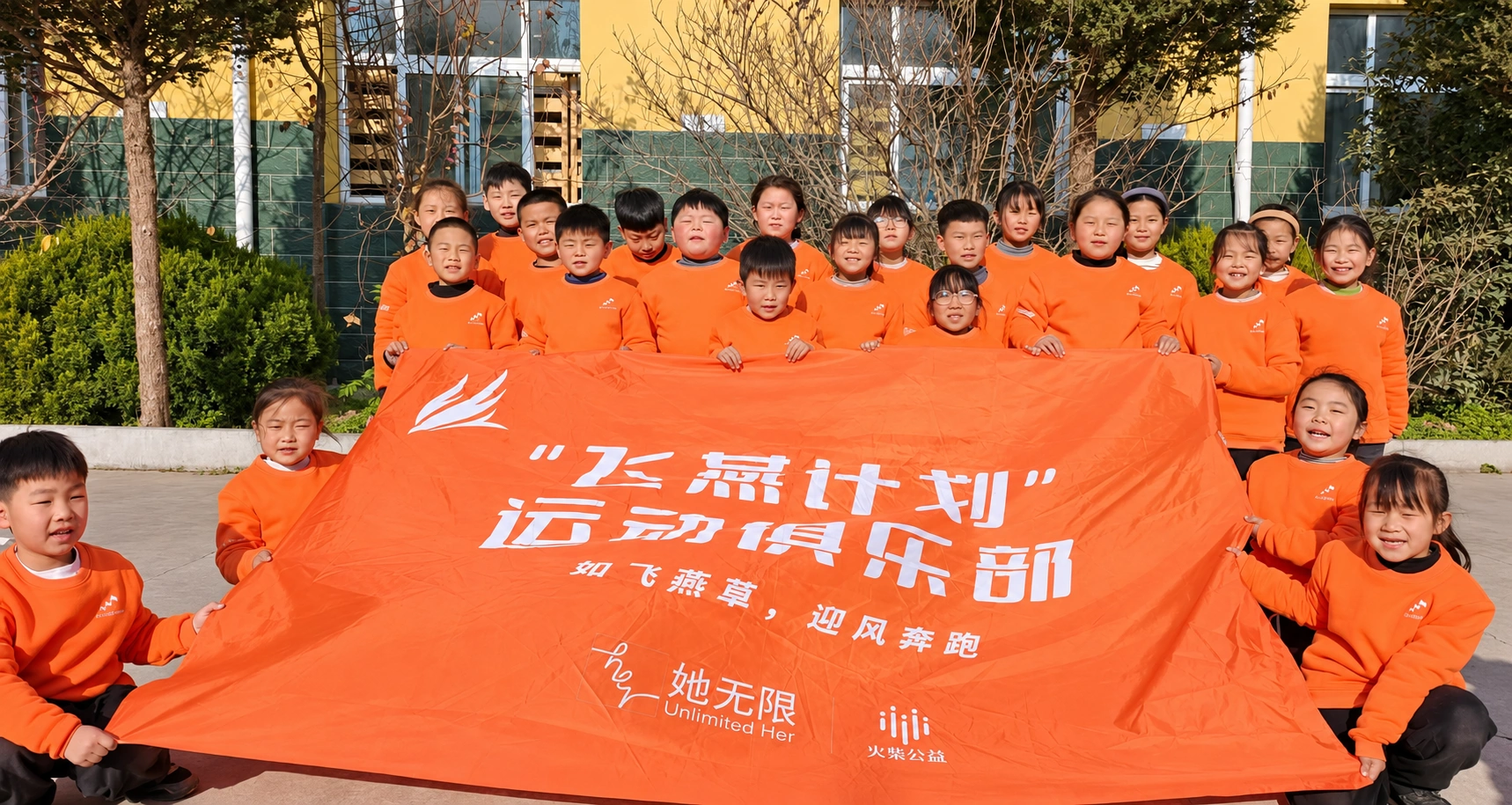 A school group pictured with a Larkspur Project banner in China